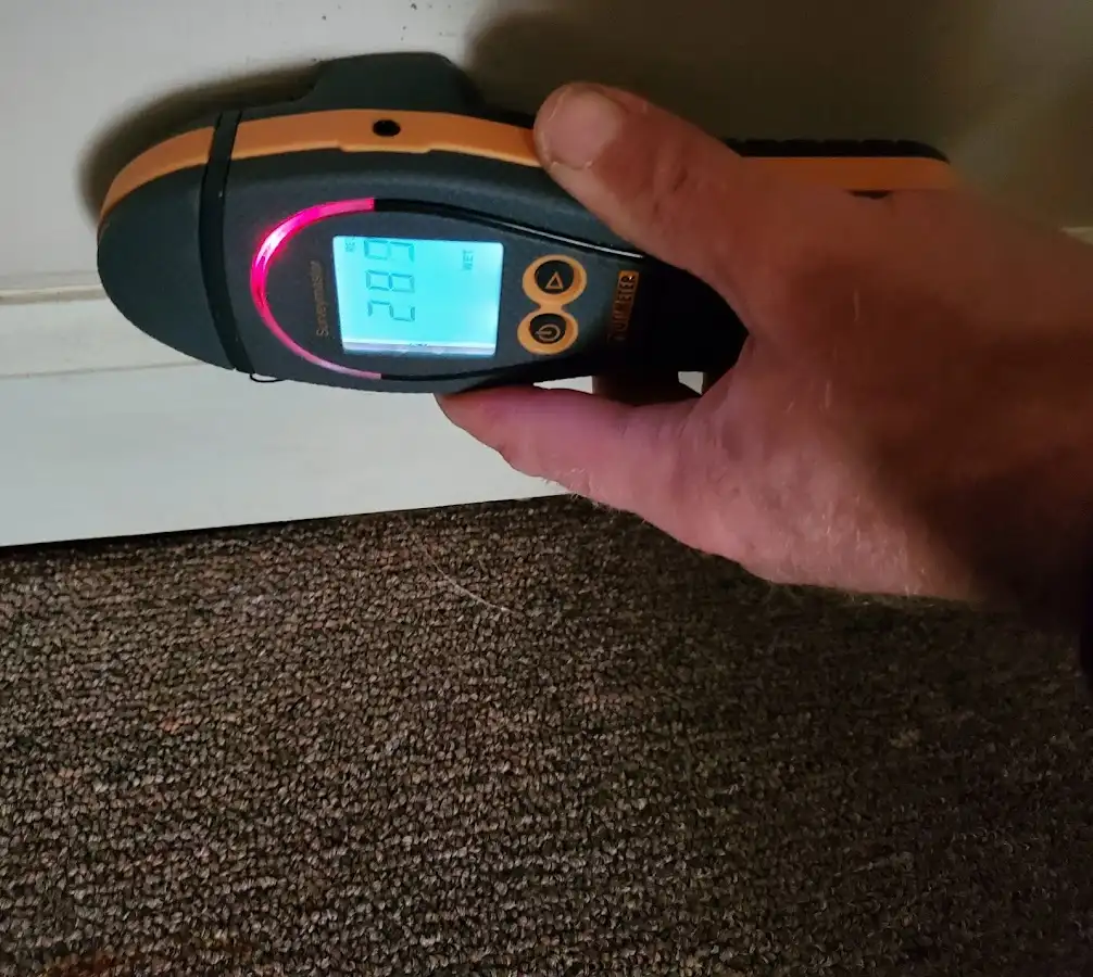 Moisture detection at baseboard during Storm Damage Restoration in Hendersonville